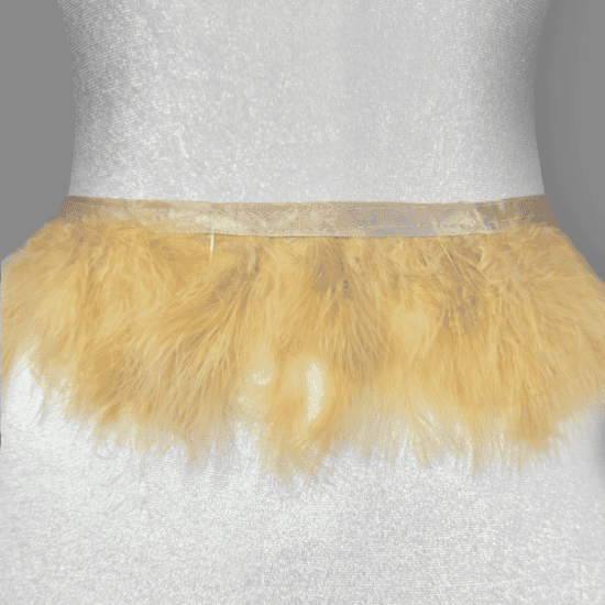 Fluffy marabou feather trim sold by the yard at Shinetrim, New Jersey's premier trim store, perfect for costumes, evening wear, and millinery projects.